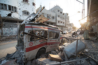 Photo taken during the 72hr ceasefire between Hamas and Israel on 6th of August 2014. Destroyed ambulance in the CIty of Shijaiyah in the Gaza Strip. Photo by Boris Niehaus (www.1just.de), licensed under  CC-BY-SA-4.0, source: Wikimedia Commons http://commons.wikimedia.org/wiki/File:Destroyed_ambulance_in_the_CIty_of_Shijaiyah_in_the_Gaza_Strip.jpg